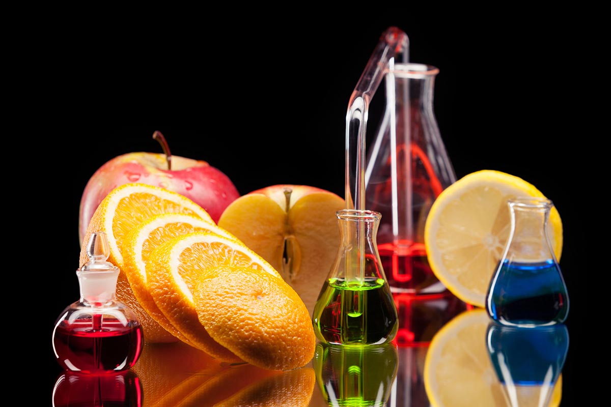 Fruits and glass test tubes filled with colored water show that terpenes for appetite are good.